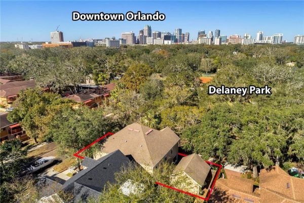 Aerial view of 1125 Delaney Ave, Orlando, FL, highlighting proximity to Delaney Park and Downtown Orlando, showcasing surrounding greenery and residential area.