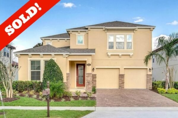 Sold home at 9007 Outlook Rock Trl, Windermere, FL, featuring a modern exterior with stone accents, landscaped yard, and a prominent "SOLD!" overlay.