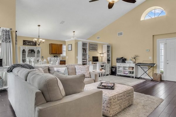 Spacious family room at 633 Remington Oak Dr, featuring comfortable seating, modern decor, and an open layout, ideal for relaxation and entertaining.