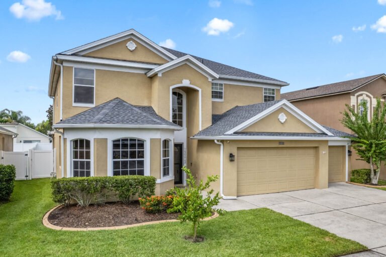 bedroom with fenced yard and car garage, priced to sell behind the manned gates of stoneybrook west, fox glove street winter garden fl