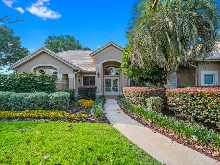 stunning custom home in the heart of windermere in the sought-after willows of lake rhea! sitting on a gorgeous over 1/2 acre lot offering privacy in your peaceful paradise! the soaring large windows throughout the home bring in tons of natural light, willow gardens drive windermere fl