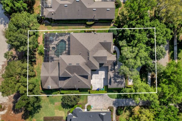Aerial view of 6264 Blakeford Drive, Windermere, FL, showcasing the custom-built estate, pool area, and landscaped grounds adjacent to the Golden Bear Championship Golf Course.