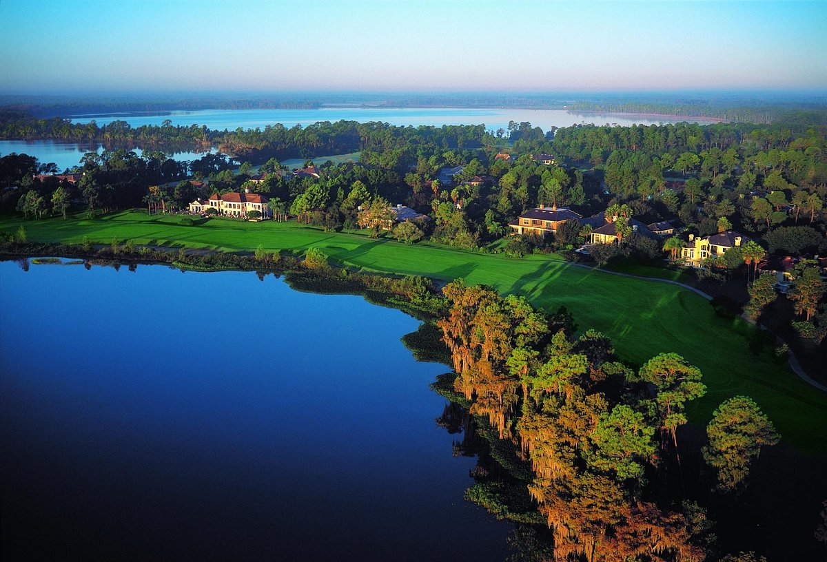 Aerial view of Windermere showcasing lush green landscapes, residential properties, and reflective water bodies, emphasizing the scenic charm of the area relevant to the 2023 real estate market analysis.
