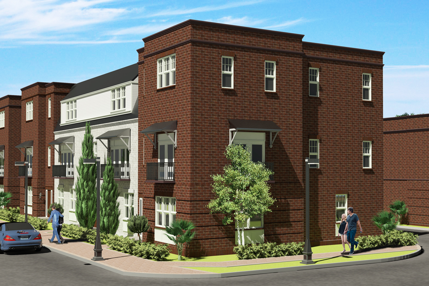 New townhouse community design in Winter Garden featuring brick exteriors, landscaping, and residents walking along the pathway.